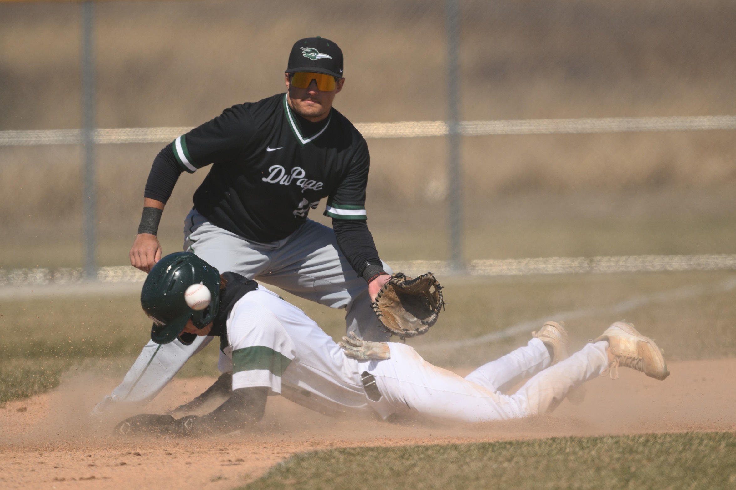 A Moraine Valley baseball player slides into the base.