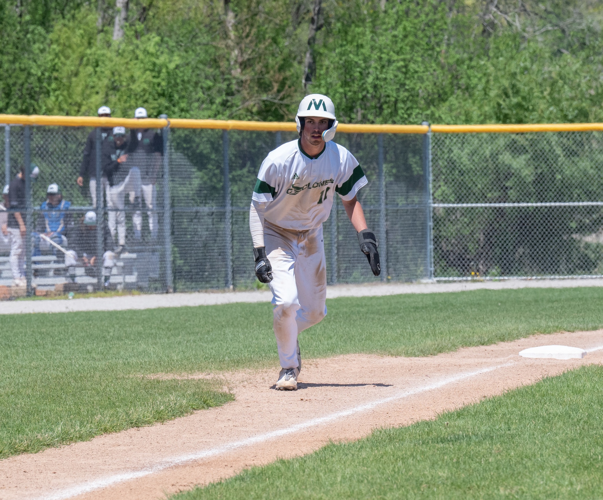 A Moraine Valley base runner rounds third.