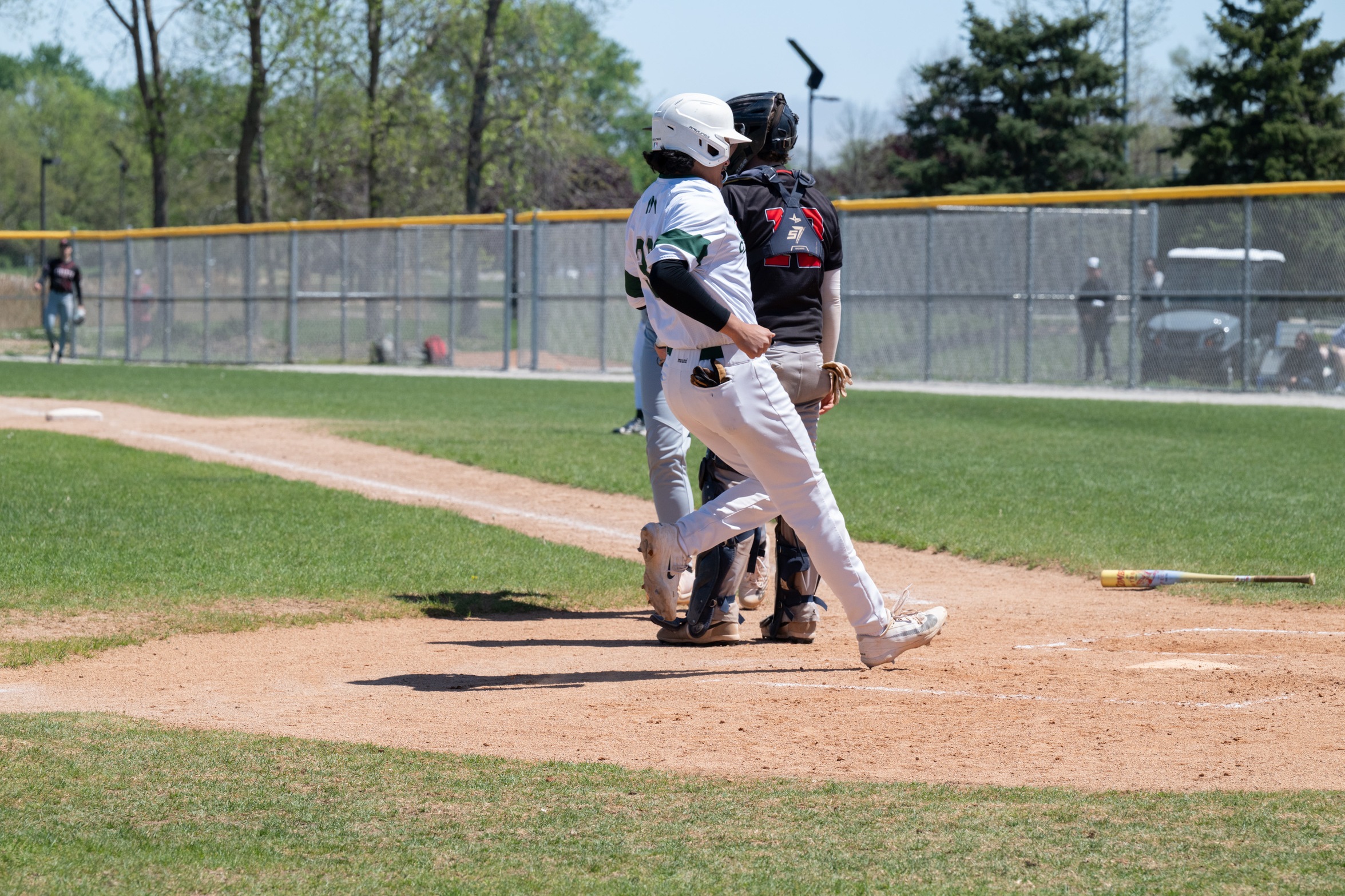A Moraine Valley batter crosses home plate.