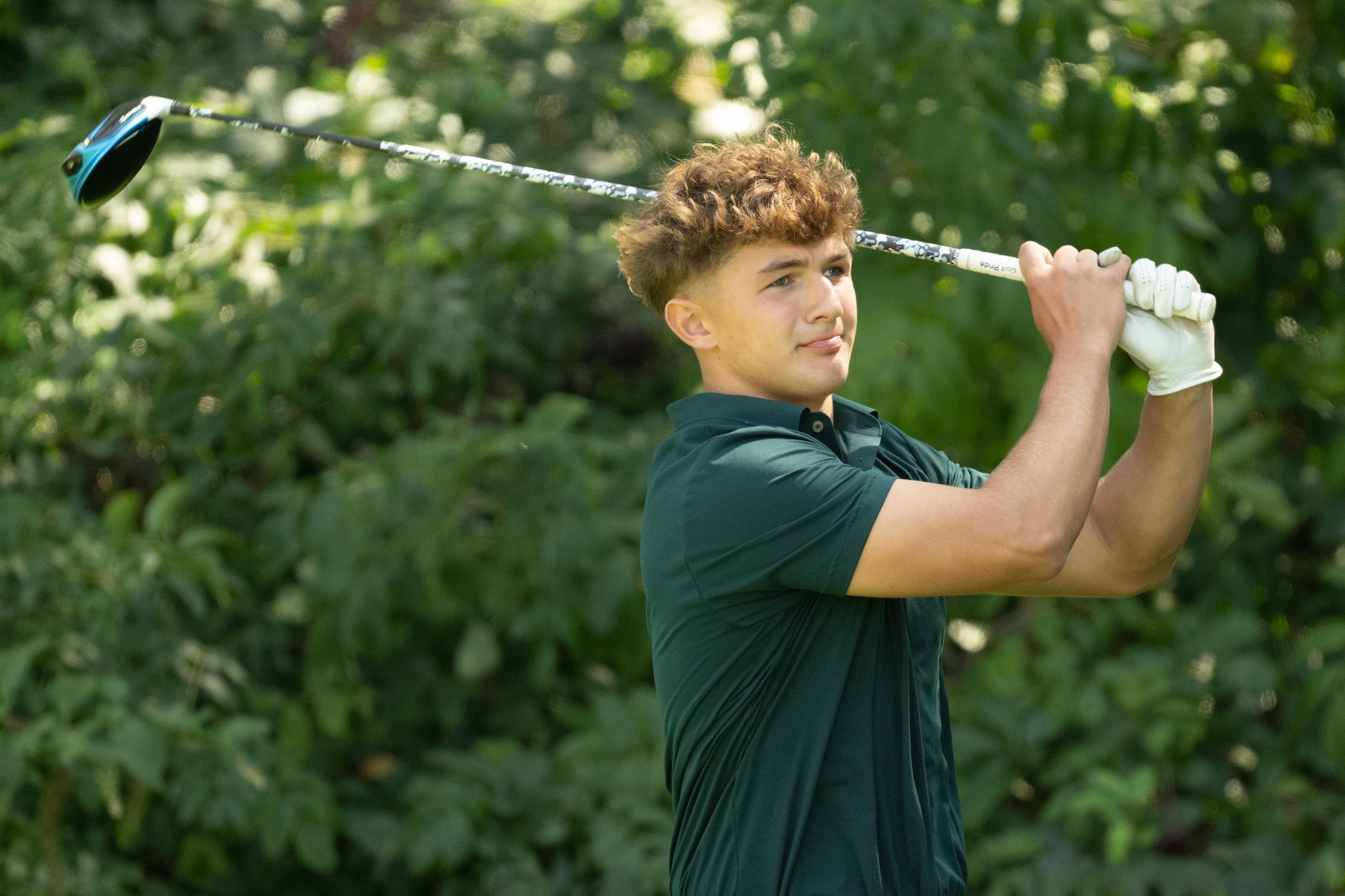 A Moraine Valley golfer hitting the ball.