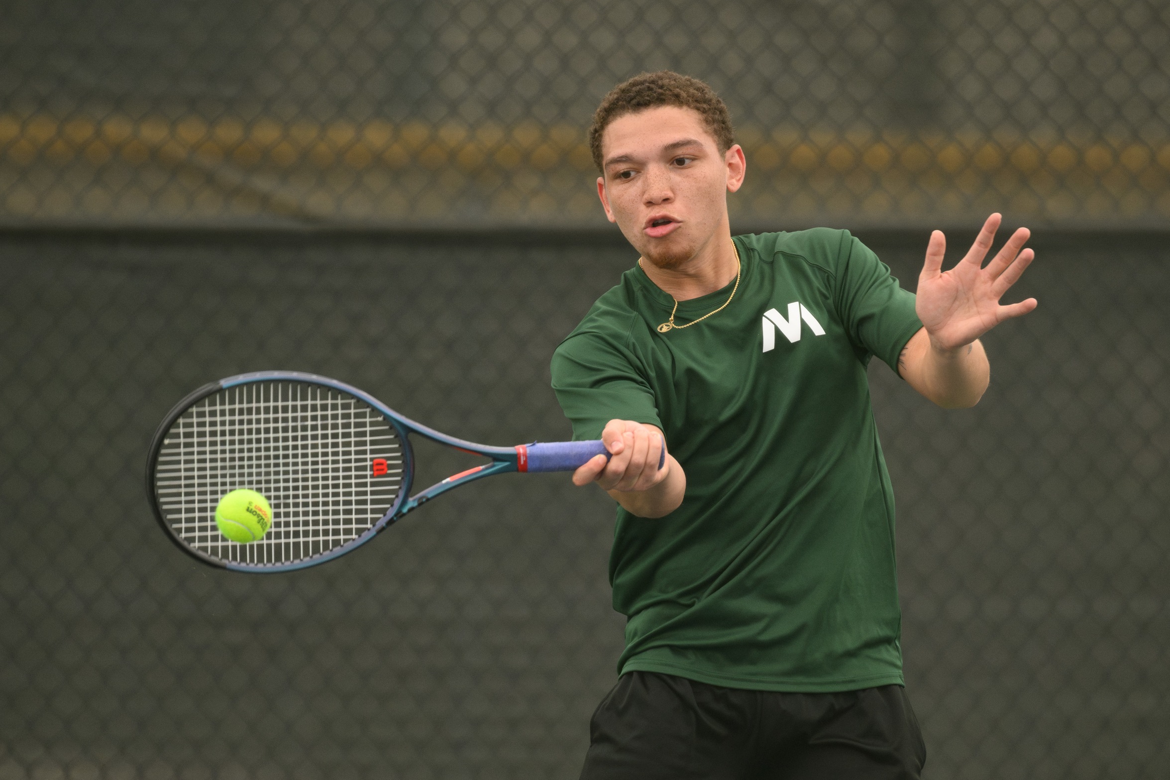 A Moraine Valley tennis player hits the ball straight on.