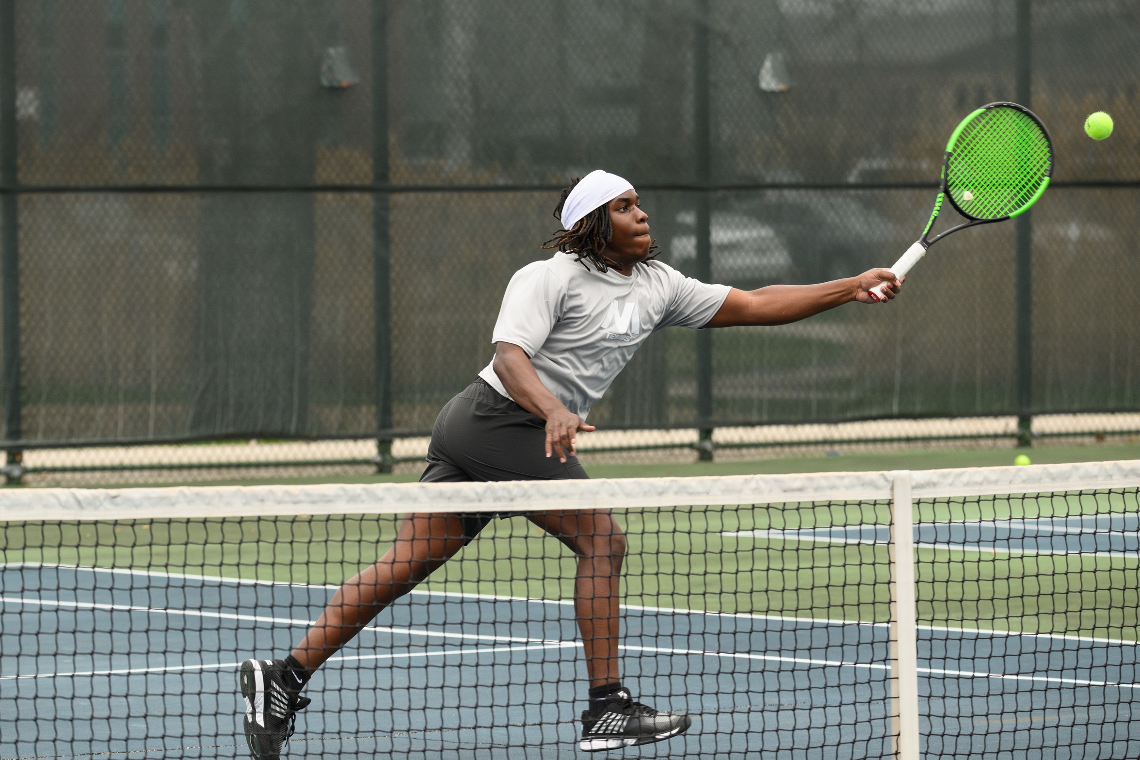 A Moraine Valley tennis player hits the ball.