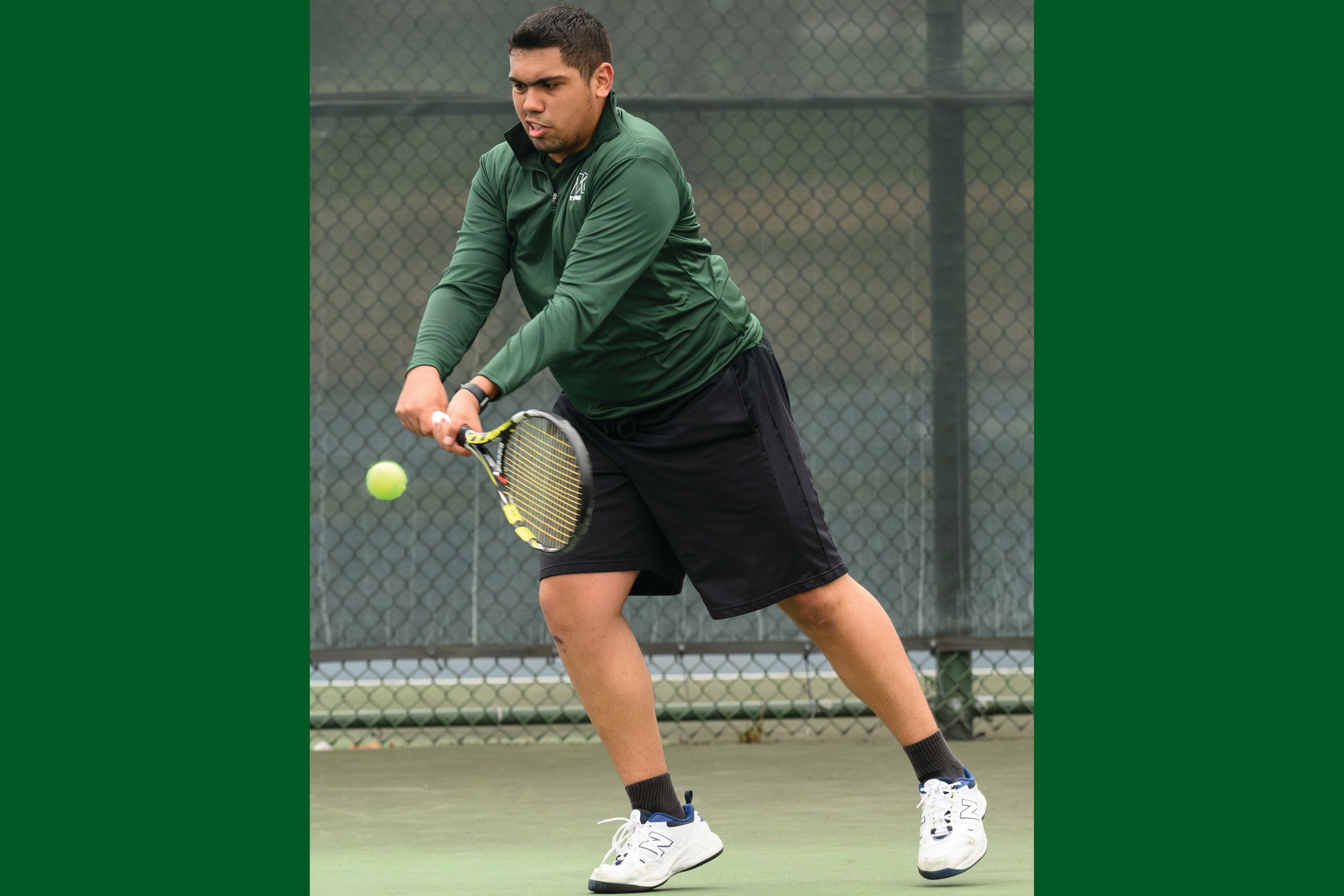 A Moraine Valley men's tennis player hits the ball.