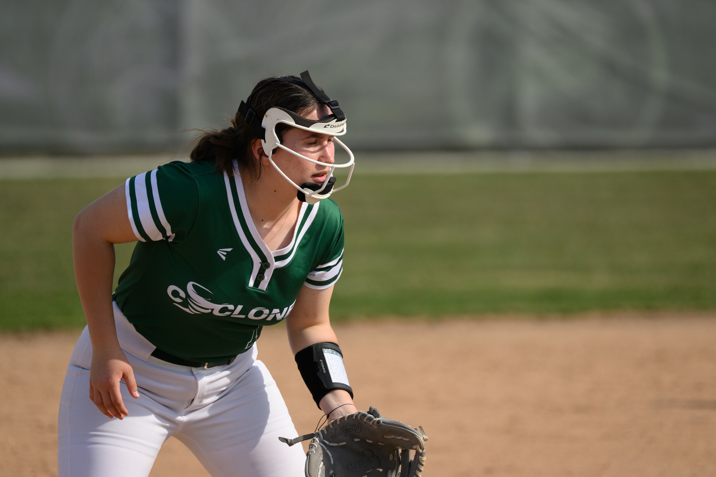 Softball player waiting to field a ball.