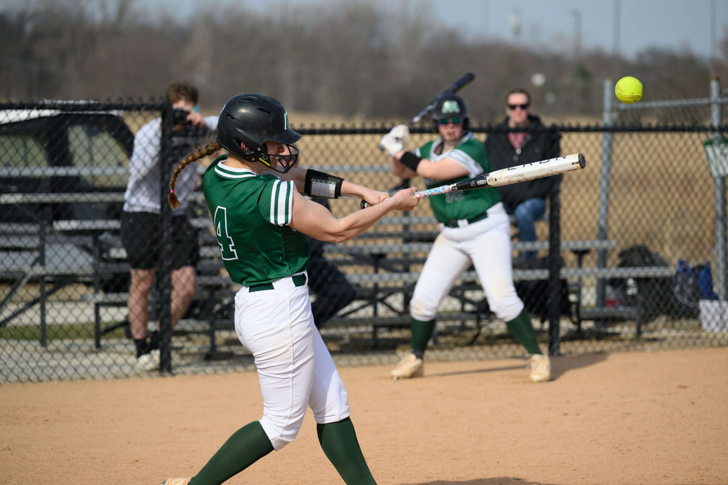 A Moraine Valley softball player hits the ball.