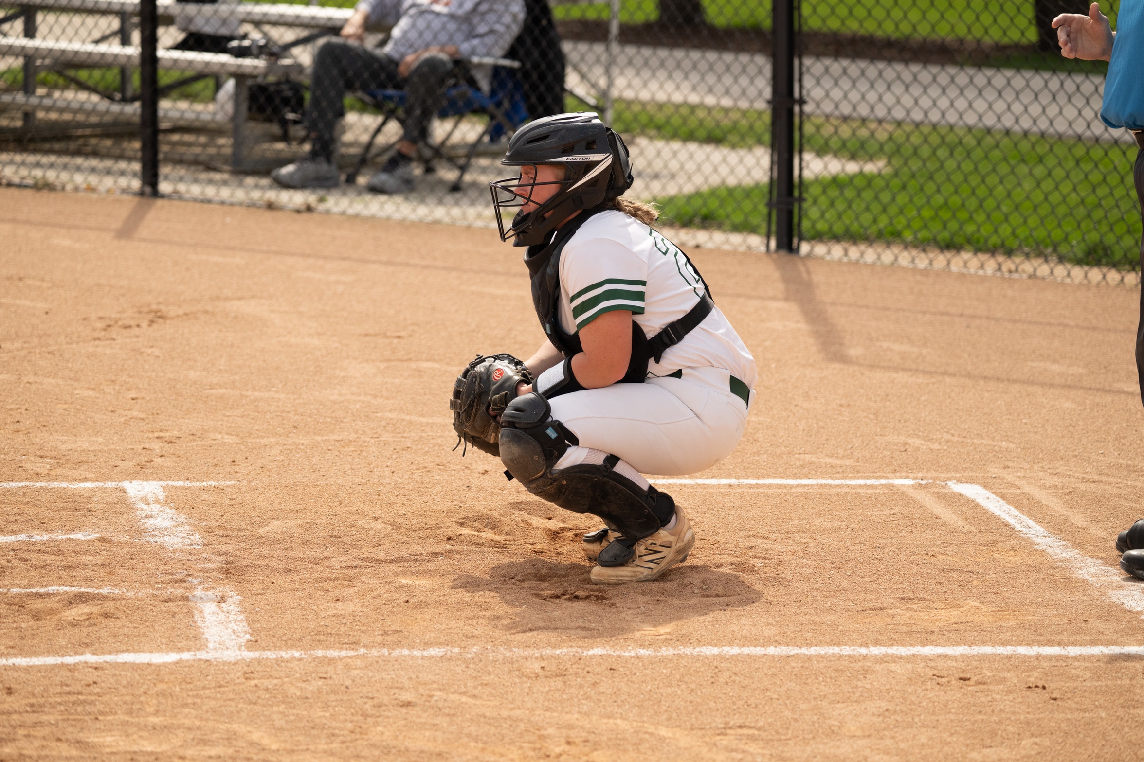 A Moraine Valley softball catcher waits for a ball.
