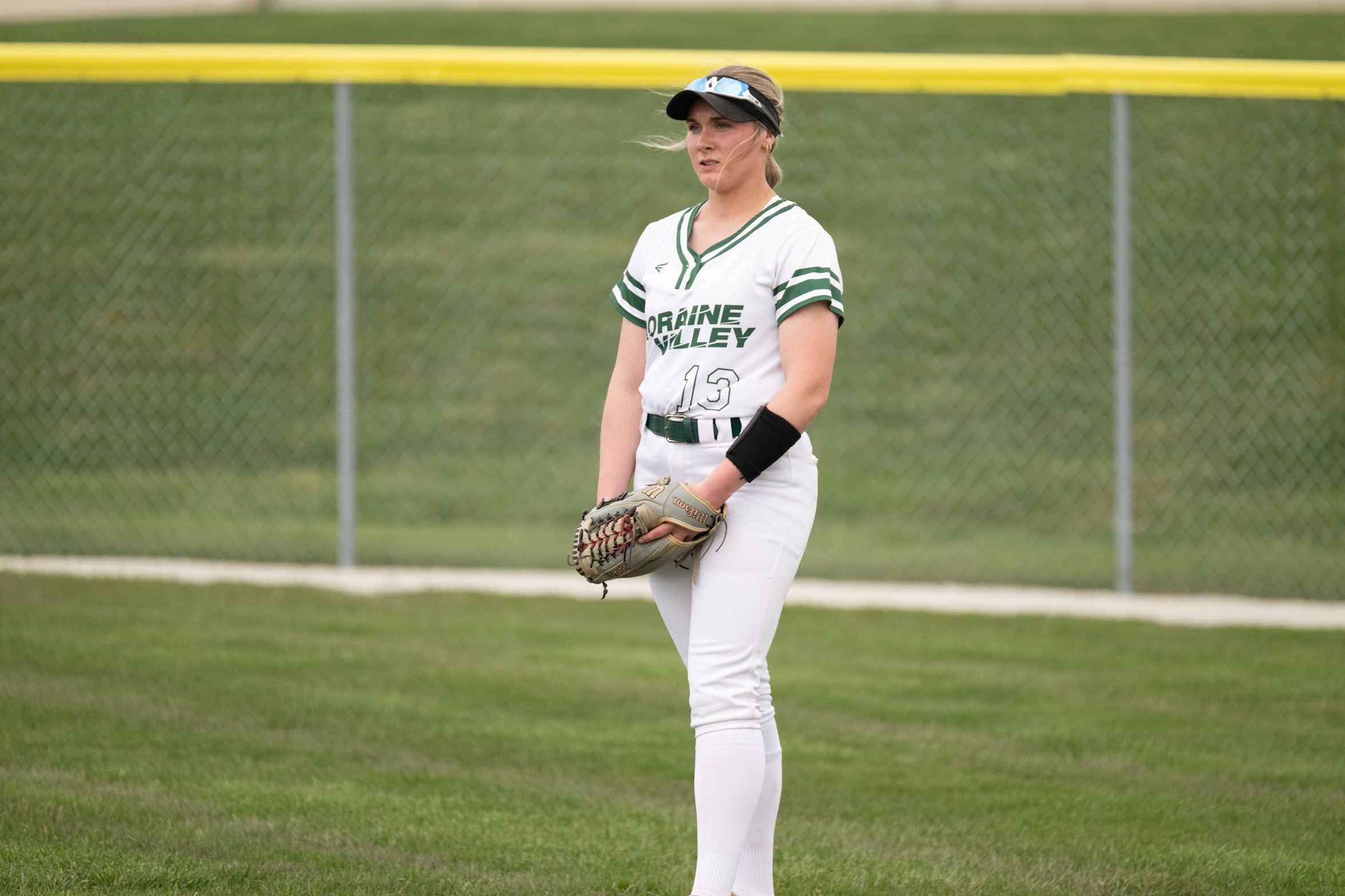 A Moraine Valley softball outfielder waits for the ball.