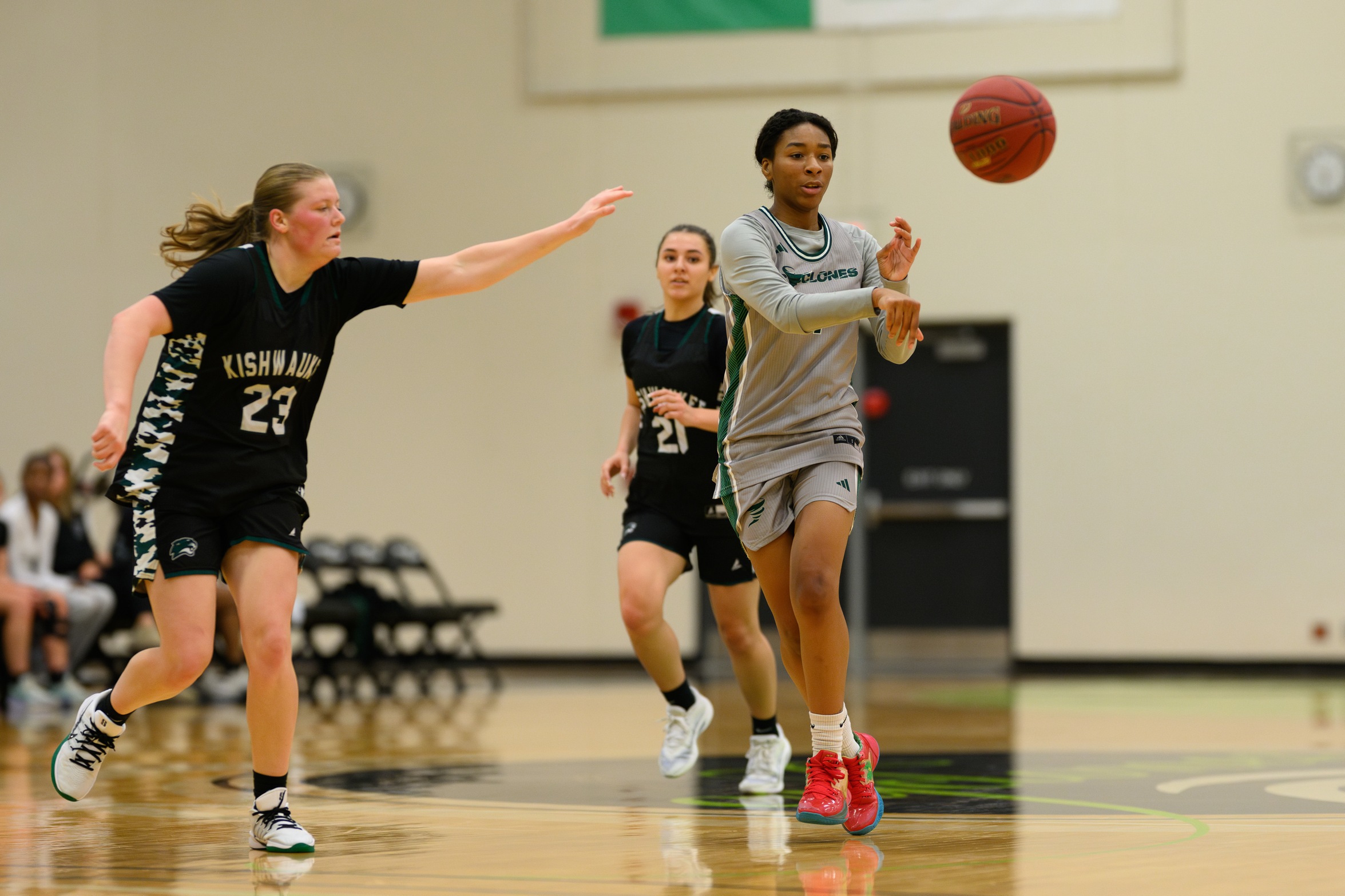 Basketball player Laila Houseworth passed the ball.